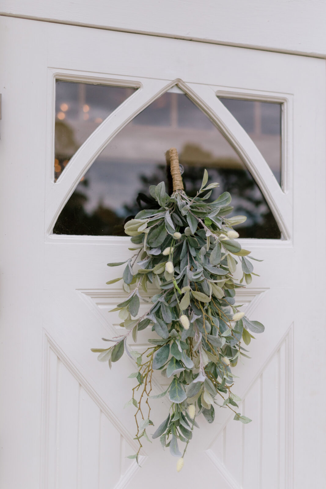eucalyptus bouquet hanging from front chapel door