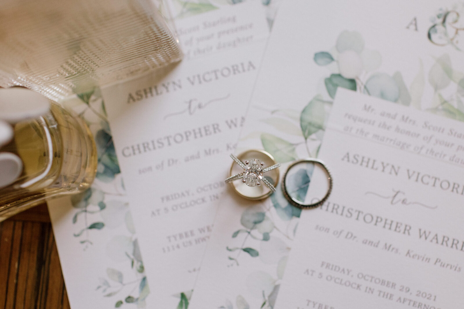 rings on top of wedding invitations